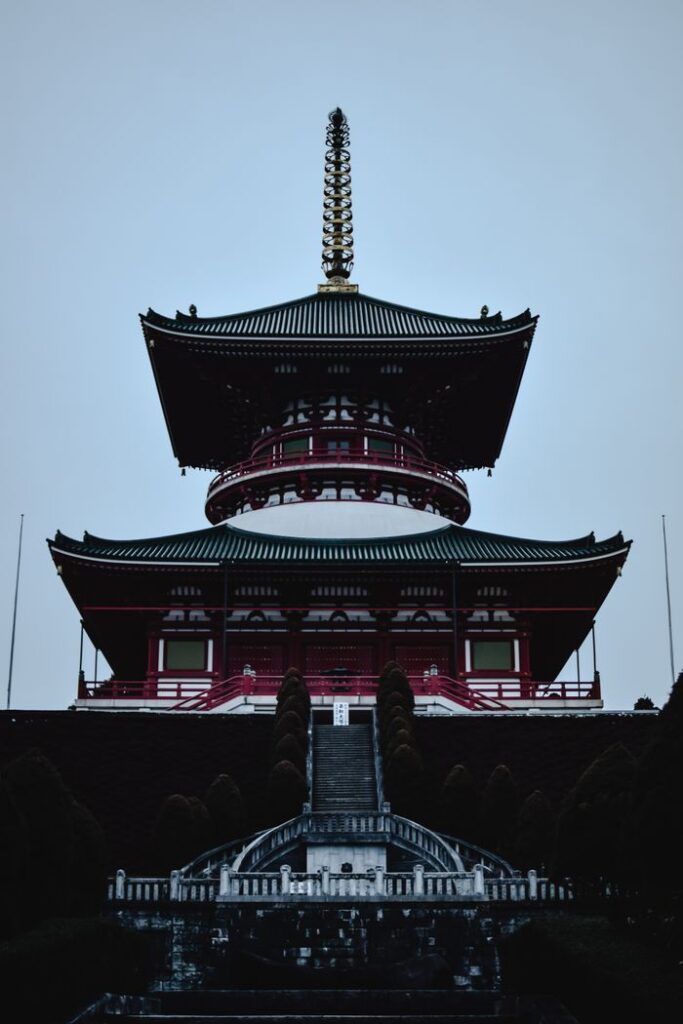 A stunning vertical view of the iconic Great Pagoda at Naritasan Shinshoji Temple in Narita, Japan.